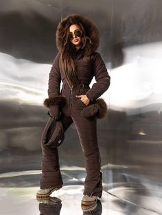 Stay warm and stylish this winter with our Elegant Women's Frost-Resistant Ski Jumpsuit with luxurious Arctic fox fur trim. Made from premium waterproof membrane fabric, this winter suit is expertly designed to block cold and wind while remaining lightweight. The high-performance insulation provides essential warmth without bulk, allowing for a sleek, figure-flattering fit. This ski jumpsuit includes thoughtful details to keep you comfortable and chic in any winter setting. It features an energy-saving lining along the chest and back for added insulation, a Velcro belt for a customizable fit, and zippered pant legs to layer easily over boots. The natural Arctic fox fur is soft and removable, attached with buttons to the hood and mittens, so you can easily adjust your look for any occasion. Cute Ski Outfits For Women, Snow Suits For Women, Ski Suits For Women, Apres Ski Outfit, Apres Ski Outfits, Ski Clothing, Ski Jumpsuit, Mountain Outfit, Kids Skis