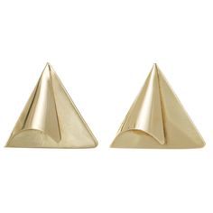 two gold pyramids are shown against a white background