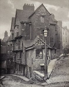 an old black and white photo of some buildings