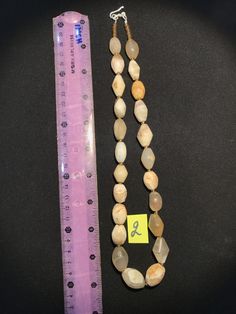 A beautiful string of Bended white agate natural found from Afghanistan dating 1800 yrs. They are found at that time in Afghanistan mostly but also some found in India and Pakistan too. They were used as a special charm jewellery by the affluents at that time period. Beautiful counter bronze are decorated further in between the beads. Antique Amber Jewelry With Large Beads, Vintage Hand-strung Oval Beads Jewelry, Vintage Hand-strung Jade Jewelry, Vintage Jade Jewelry Hand-strung, Antique Necklaces With Polished Oval Beads, Antique Necklace With Round Gemstone Beads, Large Jade Bead Jewelry, Vintage Gemstone Beads Necklace With Oval Shape, White Agate Gemstone Beads Jewelry