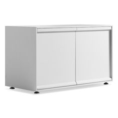 a white cabinet sitting on top of a white floor