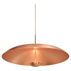 a large copper colored light fixture hanging from a ceiling