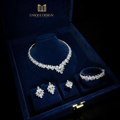 a jewelry set in a velvet box with its matching necklace and bracelet, earrings and ring