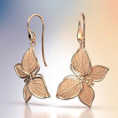 Experience Italian craftsmanship at its finest with our exquisite gold dangle drop earrings. The centerpiece of these earrings is a delicate butterfly with elegantly crafted leaves as its wings, creating a captivating and nature-inspired design. Available in both 14k and 18k gold, these earrings bring a touch of luxury and nature's beauty to your style. Elevate your look with the perfect blend of Italian artistry and organic elegance, shop now to adorn yourself with this unique masterpiece. 14k Elegant 14k Gold Butterfly Jewelry, Elegant Pierced Butterfly Jewelry, 14k Yellow Gold Earrings With Butterfly Charm, Elegant Silver Earrings With Butterfly Charm, Elegant White Gold Earrings With Butterfly Charm, Yellow Gold Leaf-shaped Formal Jewelry, Elegant Yellow Gold Butterfly Jewelry, Formal Yellow Gold Leaf-shaped Jewelry, Formal Yellow Gold Leaf Jewelry