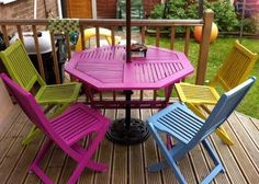 the table and chairs are painted bright colors