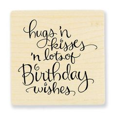 a rubber stamp with the words hugs and kisses in lots of birthday wishes