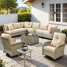 an outdoor living room with wicker furniture