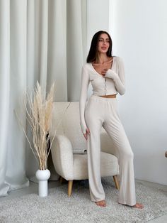 Meet our collection of knitted viscose. A soft and pleasant to the touch set, which is nice to wrap yourself in after a working day 🫶🏻 Natural home set / pajama pants + top with long sleeve viscose High-rise pants, soft elastic and perfect length, loose cut, so they are very comfortable. The top nicely delineates and does not constrain movements. A great option for clothes for home, for sleep, a great gift for a birthday, anniversary, wedding, anniversary or any other holiday for a mother, beloved wife, girlfriend, daughter, sister, close friend buy at More. Colors: milky Model is wearing size XS-S and is 5'6"/172cm (86/60/92) XS Bust - 32.3 - 33.7 inches (82-86 cm) Waist - 23.6 - 26 inches (60-66 cm) Hips - 34.6 - 37 inches (88-94 cm) S Bust - 33.7 - 35.5 inches (86-90 cm) Waist - 26 - Chic Long Sleeve Sets For Lounging, Chic Long Sleeve Lounging Sets, Chic Long Sleeve Sleep Sets, Beige Long Sleeve Sets For Home, Chic Stretch Sets For Loungewear, Fitted Beige V-neck Sleepwear, Beige Casual Pajama Party Sets, Casual Beige Sets For Pajama Party, Casual Beige Pajama Party Sets