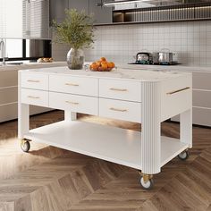 a white kitchen island with some oranges on it