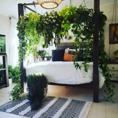 a canopy bed with plants growing on it