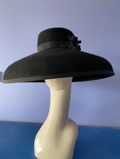 This beautiful large fur felt brimmed hat in black hand blocked custom-made by Wendy White Millinery. Add an air of elegance to your wardrobe whether it be for the races or a different event. This Hats head size is 22 1/2 inch Elegant Cloche Fur Felt Hat, Black Top Hat With Wide Brim For Evening, Black Wide Brim Top Hat For Evening, Black Evening Top Hat With Wide Brim, Elegant Fur Felt Hat For Kentucky Derby, Classic Felt Hat For Kentucky Derby Evening, Classic Evening Felt Hat For Kentucky Derby, Elegant Felt Hat For Kentucky Derby, Elegant Fur Felt Cloche Hat