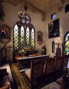 an ornate dining room with stained glass windows