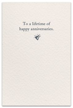 a white card with the words to a life time of happy annivers on it