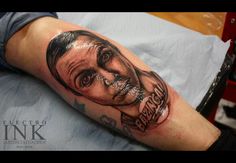 a man's arm with a portrait on it