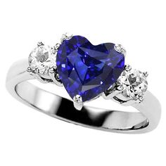 Classic Blue Heart-shaped Jewelry, Blue Sapphire Diamond Ring With Heart Cut, Classic Blue Heart Cut Ring, Classic Blue Heart Cut Rings, Fine Jewelry Sapphire Heart Cut Ring, Heart Cut Sapphire Ring In Fine Jewelry Style, Blue Heart Cut Sapphire Jewelry, Heart Cut Sapphire Ring Fine Jewelry, Blue Heart-shaped Rings With Accent Stones