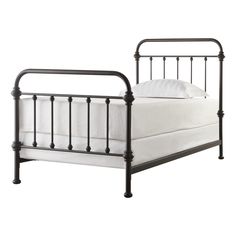 a metal bed frame with white sheets and pillows on the bottom, in an ad for target com