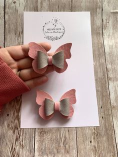 A beautiful butterfly bow made with baby pink and silver faux leather. I design and create all of the products I offer, so you can be sure you have something unique and special.Each bow is made by hand from high quality fabric locally sourced. Lots more other butterfly colour options and many more bows available on my store page, check them out! This bow is also available as a pair. The hair bow are available in  Standard 2.5 inches ( 6cm) approx. Large 3 inches Pair - 2 x 2.5 - if you order the pair with crocodile clips I will add a left and a right. Let me know if you would prefer both on the same side in either a note at checkout or send me a message :) The bows come with either a stainless steel alligator clip or a hair bobble.  ADDITIONAL INFORMATION All hair bows are made by hand. Pa Butterfly Colour, Faux Leather Hair Bows, Unique Hair Bows, Faux Leather Bows, Leather Hair Bow, Leather Butterfly, Ribbon Crafts Diy, Butterfly Bow, Hair Bobbles