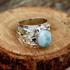 Natural Larimar Ring Wide Band Two Tone Ring Hammered Ring Sterling Silver Ring for Women Dominican Republic Larimar Blue Stone Worry RingMain Stone :Natural LarimarMain Stone Color : Blue  Main Stone Creation : Natural GemstoneMetal : Sterling SilverBase Metal : 925 parts per 1000Style : RingMetal Purity : 925 parts per 1000*SAjewellersStore is the desire and happiness for jewellery designers and makers. Beautiful, intricate and unique design jewellery making supplies. Each piece is a beauty to Two Tone Ring, Silver Ring For Women, Larimar Ring, Malachite Rings, Larimar Rings, Worry Ring, Hammered Ring, Hammered Rings, Wide Band Rings