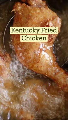 a fried chicken in a frying pan on the stove