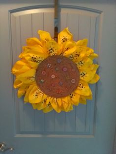 a sunflower is hanging on the front door