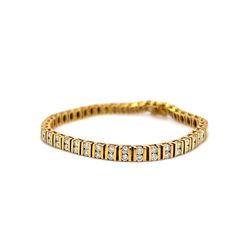 This breathtaking 5 Carat Bar Set Diamond Tennis Bracelet in 14k Yellow Gold is the perfect gift for a special occasion. The elegant and sporty bracelet features eighty-eight (88) .056 carat round brilliant cut diamonds. The diamonds are set in pairs in-between stylish 14 karat yellow gold channel bars. Geometric, sparkling, and expertly designed. The bracelet measures 7.52 inches long. A modern beauty in diamonds and yellow gold! Pair with some diamond earrings to complete the look! Formal Classic Gold Bracelet With Single Cut Diamonds, Luxury Yellow Gold Diamond Tennis Bracelet, Timeless White Gold Channel Set Bracelets, Luxury White Gold Bracelets Channel Set, Luxury White Gold Bracelet Channel Set, Luxury White Gold Channel Set Bracelets, Elegant Cubic Zirconia Diamond Bracelet Channel Set, Classic Yellow Gold Diamond Bracelet For Formal Occasions, Modern Channel Set Diamond Bracelet For Anniversary