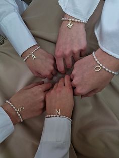 Looking for a special gift for bridesmaid for bachelorette party or wedding day? This dainty pearl bracelet is the epitome of refined elegance. Present her with a personalized token of your love, creating a connection that transcends the wedding day and becomes a cherished memory for years to come.  This personalized pearl bracelet features a beautiful golden-plated letter initial letter charm, adorned with sparkling cubic zirconia stones, that perfectly complements its elegant design.  makes it Elegant Pearl Bracelet With Letter Beads, Elegant Pearl Beaded Bracelets With Letter Beads, Elegant Bracelets With Letter Beads For Gifts, Elegant Beaded Bracelets With Letter Beads For Gift, Elegant Letter Beads Bracelet For Gift, Elegant Beaded Bracelets With Letter Beads As Gift, Elegant Pearl Bracelet With Letter Beads For Gift, Elegant Pearl Bracelet With Letter Beads As Gift, Adjustable Pearl Charm Bracelet For Bridesmaids