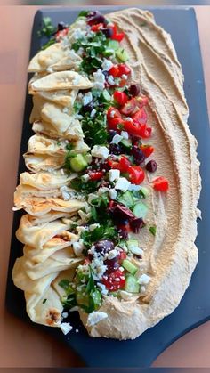 this is an image of a platter with tortillas and vegetables on it