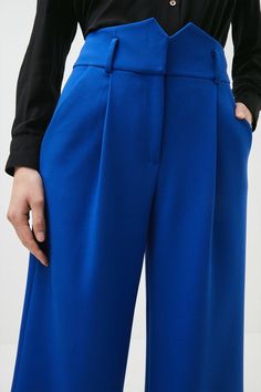 Look Chic As You Pound City Streets In These Office-Appropriate Trousers. Spun From Rich, Stretchy Fabric, They Show Off A Wide-Leg Silhouette And Sophisticated Notched Detailing At The Waistline. Wear Them With Our Matching Waistcoat And Jacket For A Considered Work Look. Modern Tailored Structured Pants, Modern Structured Office Bottoms, Spring Business Pants In Elastane, Spring Business Elastane Pants, Chic Structured Bottoms With Pressed Crease, Spring Business Pants Made Of Elastane, Elegant Blue Wide Leg Pants For Work, Chic Structured Pantsuit With Pressed Crease, Trendy Ankle-length Dress Pants For Work