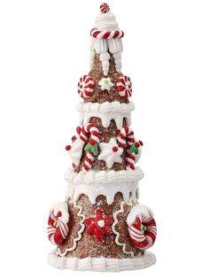 a christmas tree made out of cookies and candy canes on top of each other