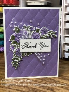 a thank you card with purple flowers on it