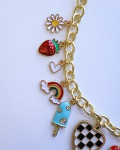 Add a splash of sunshine to your style with our Bright Summer-Themed Gold Plated Charm Necklace. This fun and vibrant accessory features an array of playful summer charms, perfect for capturing the season's essence. Measuring 17 inches in length, it's the ideal piece to brighten up any summer outfit. Crafted with high-quality gold plating, this necklace is designed to bring a touch of joy and color to your wardrobe. Playful Multicolor Necklaces With Charms, Playful Adjustable Necklaces With Charms, Playful Multicolor Jewelry With Removable Charms, Playful Dangle Necklaces With Charms, Playful Dangle Charms Necklace, Playful Dangle Charm Necklace, Trendy Multicolor Jewelry With Removable Charms, Whimsical Multicolor Charm Necklaces With Lobster Clasp, Trendy Multicolor Charm Necklace With Lobster Clasp