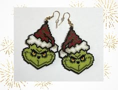 These stunning handmade beaded Grinch earrings are the perfect way to get into the holiday spirit. The earrings are not only a stylish accessory but also a conversation starter and being handmade ensures that each pair is unique, making them a special gift idea for Grinch lovers and jewellery enthusiasts alike.  Japanese Miyuki Delica glass seed beads size 11 were used in making these fabulous earrings, in the colours red, white, linen, yellow, black, light and dark green, gold or silver, using Beaded Christmas Earrings, Grinch Earrings, Festive Jewellery, Xmas Earrings, Holiday Beading, Beaded Crafts, Beaded Jewelry Patterns, Earrings Green, Handmade Holiday