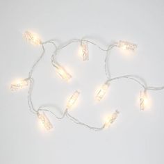 a string of christmas lights on a white background with no one around them or in the photo