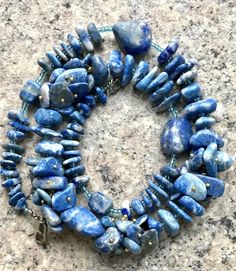 Size52cm (20.4 in) Materialnatural stoneVintage beads made of natural stone (lapis lazulisodalite), strung through Czech beads.year of manufacture1970sAll items are absolutely guaranteed to be genuine and as described. Buy with confidencewe are professional, fulltime dealers in business for many years. We pack and ship your purchases with care and consideration in a timely manner. With us, you can expect FirstClass service and helpful consultation at no extra charge.If you have any questions, wr Necklaces Beads, Vintage Necklaces, Vintage Beads, Czech Beads, How To Make Beads, Vintage Necklace, Lapis Lazuli, Natural Stone, Natural Stones