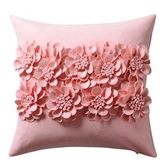 a pink pillow with flowers on it