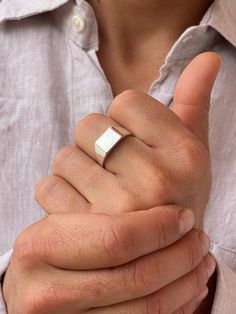 This is a classic square silver signet. A men sterling silver ring that shines for its simplicity. And square geometric male silver signet that can we worn by its self or combined with other rings. Minimal and geometric shapes with their hard angles and edges have long been a source of my inspiration. I always say that the simplicity is the beauty of live. Geometric and minimal jewelry is great for an everyday use. Geometric styles look tidy and chic, with the bonus that they don't get caught on your clothing or hair like other dangly jewelry styles. This is Urban jewelry, for those who not only want to wear special designs but also with meaning.  The surface of the square is 5mm x 7mm. Name of the ring: ETERNAL... live you present. Die with memories, not with dreams. Every time we make a Mens Silver Signet Ring, Rings Minimal, Onyx Ring Men, Urban Jewelry, Ring Square, Ring Man, Silver Signet Ring, Jewelry Styles, Black Onyx Ring