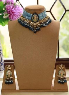 Kundan choker necklace with matching earrings Perfect for any kind of occasions and ceremonies. You can wear it with Saree lehenga and Evening Gowns. Highest quality and craftsmanship. Arrives in box Please let me know if you have any questions Traditional Blue Festive Choker, Blue Kundan Necklace For Celebration, Blue Kundan Necklaces For Reception, Blue Kundan Necklace For Reception Festivities, Blue Kundan Necklace For Festive Reception, Blue Kundan Necklace For Reception And Festive Occasions, Blue Bollywood Necklace For Receptions, Blue Bollywood Jewelry For Reception, Blue Kundan Necklace For Reception