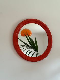 Orange Wooden Round Mirror / Vintage Circle Mirror / Mid Century Modern Wall Mirror / Space Age Mirror / Atomic / Home Decor / Italy / 1970s Step back in time with this Mid Century Modern wall mirror inspired by the chic aesthetics of 1970s Italy. This vintage circle mirror, crafted with a vibrant orange wooden frame, brings a touch of retro charm to any space. Perfect for adding a pop of color and style to your home decor, this round mirror is a unique piece that effortlessly merges vintage all Wooden Round Mirror, Space Age Decor, 70s Mirror, Mirror Mid Century Modern, Mirror Space, 1970s Italy, Mirror Mid Century, Mid Century Mirror, Aged Mirror