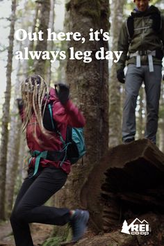 a man and woman hiking through the woods with text that reads out there, it's always leg day