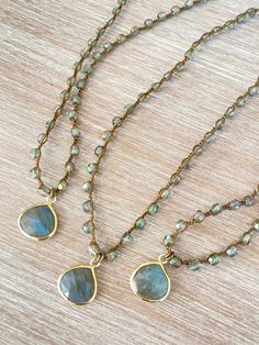 Denim crystal with a sparkly sheen paired with a lovely drop of faceted labradorite set in vermeil. Labradorite Necklace is 17.5” long with button and loop toggle closure. You can add a touch of elegance and sparkle to any outfit with the Denim crystal and faceted labradorite necklace. Gold Beaded Necklace With Labradorite Stones, Gold Labradorite Gemstone Beaded Necklace, Handmade Gold Labradorite Beaded Necklaces, Gold Labradorite Crystal Necklace With Gemstone Beads, Gold Crystal Necklaces With Gemstone Beads, Gold Labradorite Jewelry With Faceted Beads, Gold Teardrop Labradorite Necklace, Adjustable Teardrop Gemstone Beaded Necklaces, Homemade Necklaces