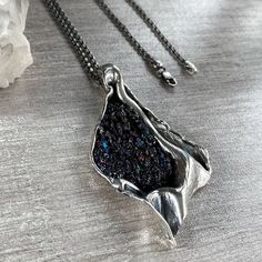 Handmade abstract pendant, Raw carborundum crystal necklace in Sterling silver, Freeform black druzy pendant for women, Raw crystal pendant Absolutely handmade silver pendant with raw carborundum crystal. This is a perfect gift idea to those who love unique, exclusive pieces and abstract style. Also, perfect for women who love designer jewelry! The stone has a shiny and adorable look. It has a very beautiful sparkle under the sun. 【FULL DETAILS】 ► Gemstone: natural raw carborundum Pendant length Elegant Raw Stone Crystal Pendant Necklaces, Elegant Pendant Crystal Necklaces With Raw Stone, Elegant Crystal Pendant Necklaces With Raw Stone, Silver Pendant Crystal Necklace With Raw Stone, Unique Metal Pendant Crystal Necklaces, Unique Metal Pendant Crystal Necklace, Silver Pendant Necklace With Raw Stone, Silver Necklace With Raw Stone Round Pendant, Unique Silver Necklace With Raw Stone