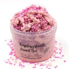 a container filled with pink sprinkles and candy