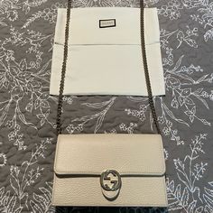 Gucci Limited Edition Embossed Ivory Leather With Light Fine Gold Chain And Leather Strap. ***Includes Box And Dust Bag Interior Has 18 Card Slots And One Zip Pocket With Open Space Compartment Exterior Has Light Gold Gg Snap Closure Measures 7.5”X4.5”X1.5” With A 22” Chain Drop Luxury Beige Wallet On Chain For Evening, Gucci Cream Shoulder Bag For Evening, Beige Wallet On Chain With Chain Strap For Evening, Beige Wallet On Chain For Evening, Formal Beige Wallet On Chain With Chain Strap, Classic Gucci Wallet On Chain For Evening, Gucci Luxury Wallet On Chain For Formal Events, Elegant Beige Wallet On Chain With Chain Strap, Classic White Wallet On Chain For Formal Occasions