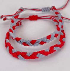 Handmade set of 2 braided bracelets in your favorite team colors. Sea, sun, snow, sweat and shower safe. One size fits most. Scarlet and Gray, Red and gray, scarlet and silver, red and silver. Guys wear 'em, too. Adjustable Braided Red Jewelry, Red Braided Bracelet With Sliding Knot For Friendship, Red Braided Friendship Bracelet With Sliding Knot, Casual Red Braided Bracelets For Beach, Casual Red Braided Bracelet For Beach, Red And Silver, Braided Bracelets, Red And Grey, Team Colors