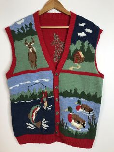 an ugly sweater vest is hanging on a wooden hanger and it's colorfully decorated