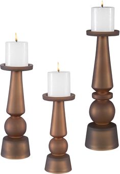 three candles sitting on top of each other