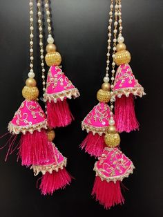 15" wedding fuchsia pink indian bridal lehenga embellishment zardosi decorative hanging tassel | silk fabric wedding tassel with bead chainHandmade Hanging/tasselsMaterial:Silk, Thread, MotifsPackage Contents: 2Key Features:Embroidery art workThis  is good match with both Indian and western outfits and are superb for wedding and festive parties.This would be best complement to your designer saree, lenhga or any other kind of dress.This is the combination of traditional and modern embroidery work