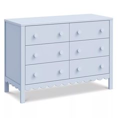 a white dresser with scalloped drawers on the top and bottom, against a white background