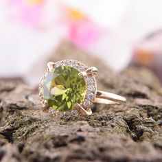 "Peridot ring, Yellow gold ring, Art deco ring, Anniversary ring, Antique ring, Victorian ring, Geometric ring, Gold ring for her WE OFFER UNLIMITED PERIOD INSTALLMENTS PLAN This is a beautiful, stunning, feminine ring that works well for all occasions, styles, and ages. You will love it! Ring information: Main stone: Peridot Approximate size: 9mm Accent stone: Cubic zirconia Metal type: Gold Metal stamp: 14k Gold Customization / Replacements It's easy to create jewelry that's perfect for you. C Green Halo Rings For Anniversary, Green Halo Ring With Round Band, Yellow Gold Rings With Halo And Round Stone, Green Halo Promise Ring, Gold Emerald Ring With Halo Design, Yellow Gold Crystal Ring With Accent Stones, Green Cluster Ring With Halo, Gift Yellow Gold Halo Ring With Center Stone, Gold Rings With Gemstone For Promise