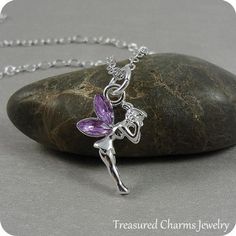 This Fairy Charm necklace comes on a silver-plated chain that is available in different lengths. Please choose your desired length from the drop-down menu when placing the item in your shopping cart. { CHARM DETAILS }★ Material: Pewter with Purple Crystal Accents★ Finish Color: Silver★ Measurements: 1/2" x 3/4"★ Dimensions: One-sided★ Made in the USA{ SIMILAR ITEMS } More fairy themed items available from my shop: https://www.etsy.com/shop/treasuredcharms/search?search_query=fantasy{ GIFT OPTION Silver Fairycore Necklace, Whimsical Silver Dangle Charm Necklaces, Silver Fairy Grunge Dangle Jewelry, Fairy Grunge Silver Dangle Jewelry, Fairy Style Silver Jewelry For Gift, Silver Fairy Grunge Necklace As A Gift, Silver Fairy Grunge Necklace For Gift, Fairycore Silver Jewelry Gift, Fairy Charm Necklace